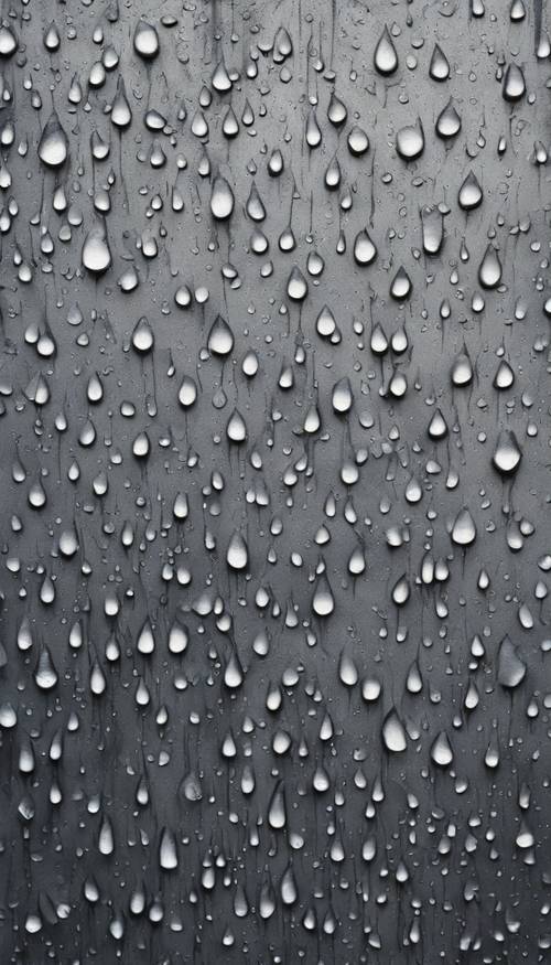 A close-up of a gray concrete wall with raindrops making their way down its rough texture. Tapéta [45ecf0a657d84de99cc5]