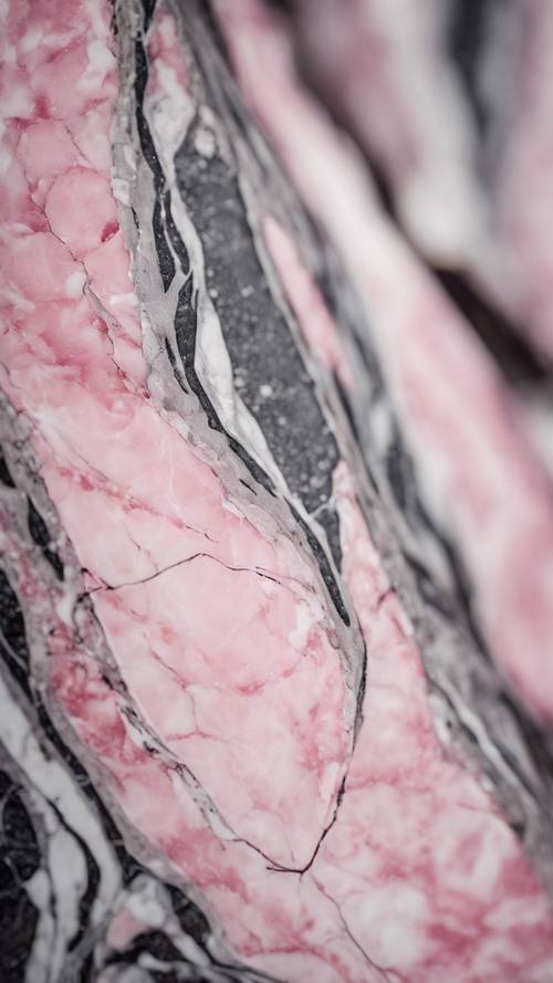 A piece of pink marble with veins of white and grey, sparkling under the midday sun.