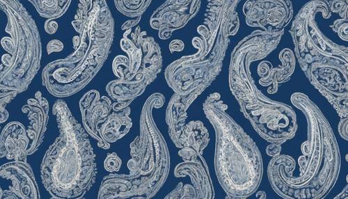 A subtle motif of white paisley patterns onto a denim blue background.