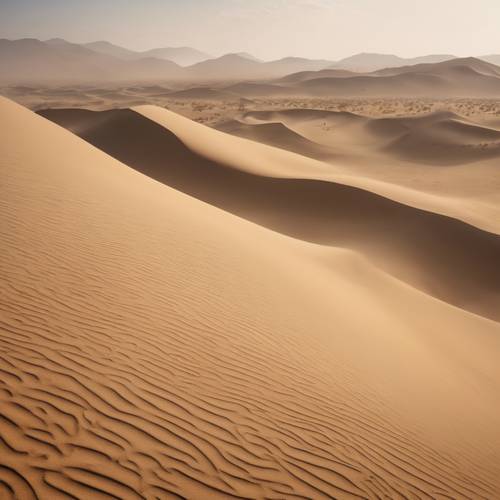 Pemandangan gurun saat terjadi badai pasir, dengan angin menciptakan pola berputar-putar di permukaan bukit pasir.