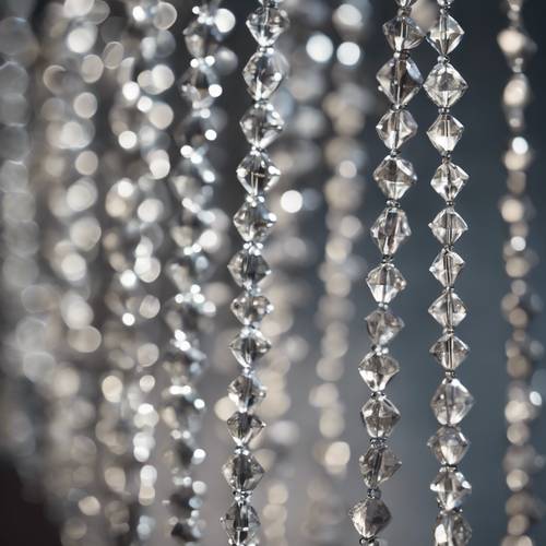 A delicate strand of gray diamond beads strung together.