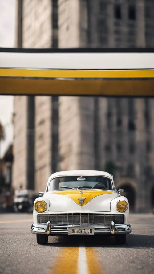 A classic vintage white car with a glossy yellow stripe running down the middle.
