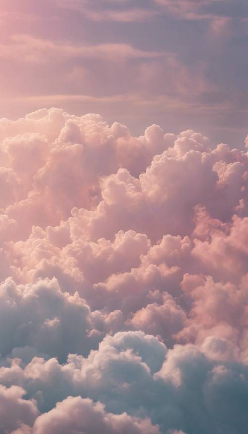 Clouds filled with pastel shades, gently shifting in the welcoming embrace of the dawn. Tapet [0541e79ffac44e6a9e7c]