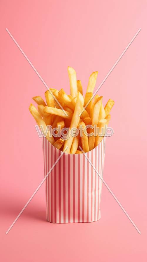 Crispy French Fries on Pink Background