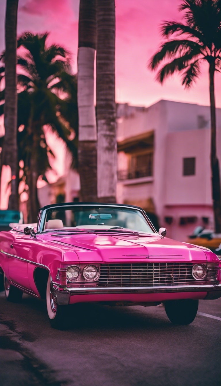 A neon pink vintage convertible parked on the streets of Miami at sunset. Ფონი[60519c8d569b42a2820e]