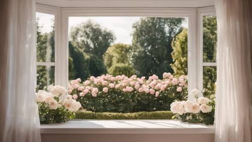 A large bay window with soft white curtains swept by a summer breeze, showcasing a well-manicured rose garden outside.