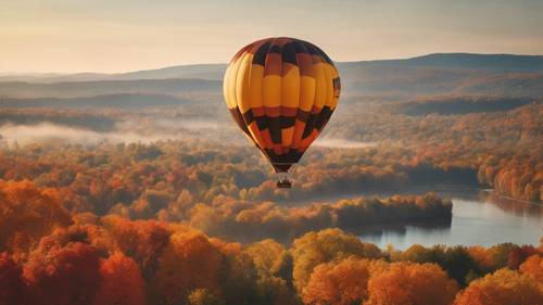 A hot air balloon flying over a breathtaking landscape of fall foliage.