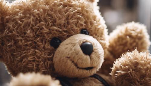 A tan teddy bear with detailed stitching and furry texture.