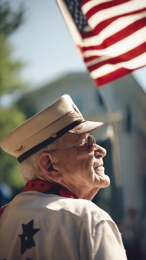 An elderly veteran saluting the flying United States flag on a sunny Fourth of July morning.