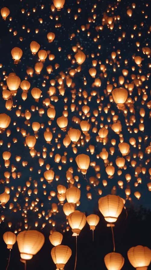Hundreds of small, glowing paper lantern balloons illuminating the starlit night sky.
