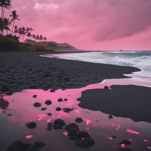 A volcanic black sand beach under a cotton-candy pink sky, forming an intriguing aesthetic contrast.