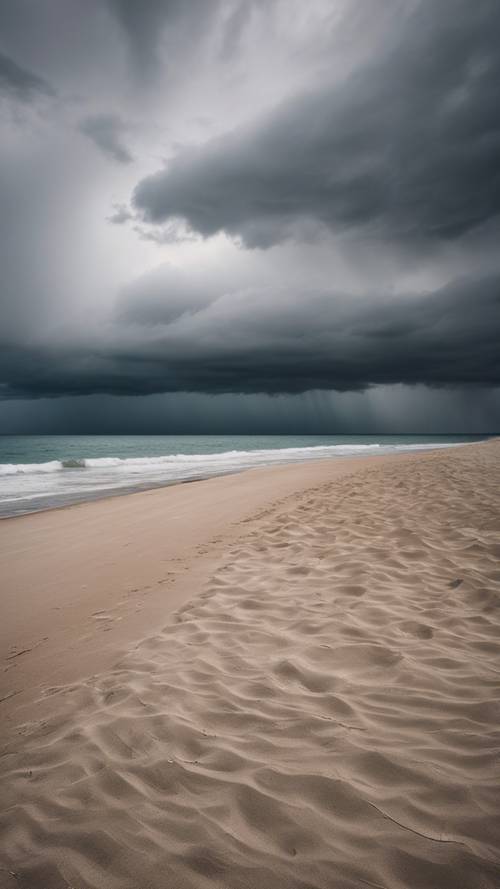 An empty, peaceful beach along Lake Michigan under imposing storm clouds.