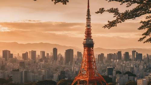 Tokyo Tower as the sun sets in the background, casting an orange hue over the structure.
