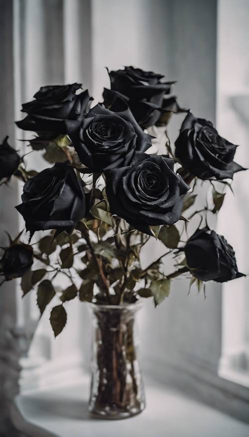 A gothic styled bouquet of stunning black roses with thorns.