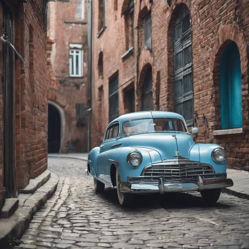 A vintage car in a shiny baby blue color parked in an old brick street.