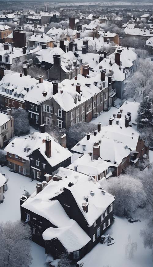 An aerial view of snow-covered rooftops and smoke curling from chimneys. Tapet [b3f69dd3d9b24108a67c]