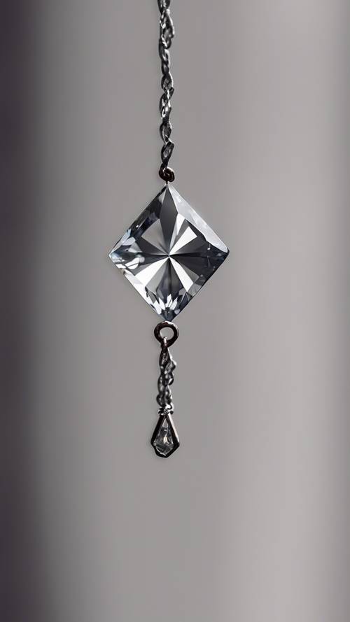 A gray diamond charm dangles delicately from a bookmark, catching the attention of book lovers.