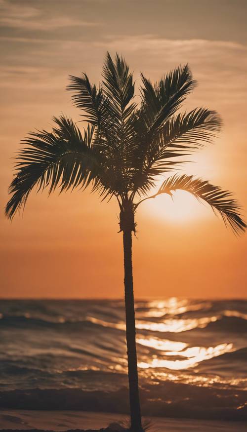 Una sola palmera verde meciéndose con el viento contra una puesta de sol naranja.