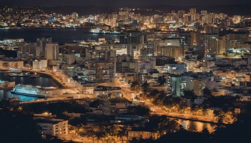 Vista noturna do horizonte da capital San Juan, Porto Rico, com portos movimentados