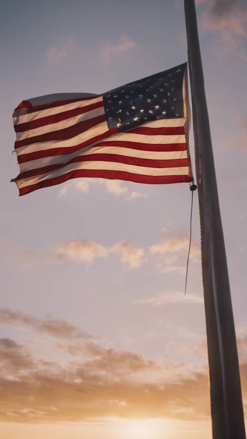 Una bandiera americana esposta a mezz&#39;asta durante il tramonto, evoca un senso di malinconia.