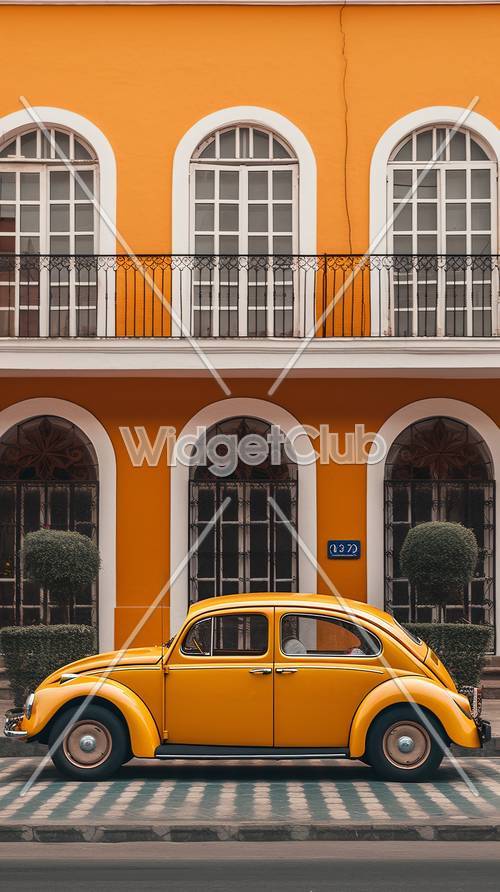 التناغم البرتقالي: السيارة الكلاسيكية والمبنى الملون