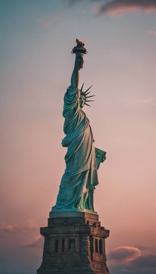 A view of the monumental Statue of Liberty elegantly highlighted at nightfall in New York City.