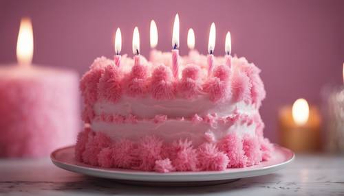 A pink birthday cake with fluffy icing and twinkling candles.