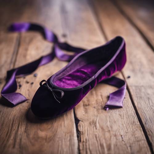 A pair of velvet ballet shoes strewn on a wooden floor, the color being a rich blend of black and purple.