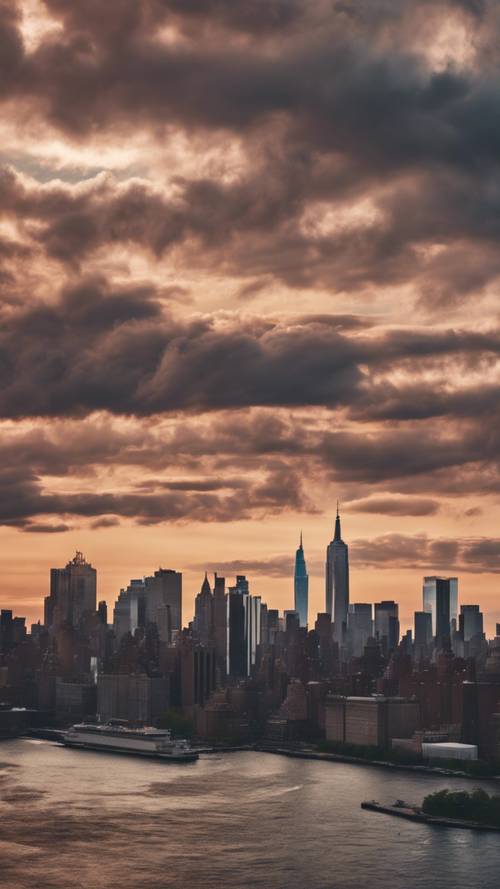 A broad view of New York City's modern skyline at sunset with textured clouds floating overhead