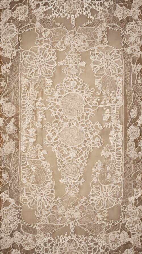 A vintage, lace tablecloth with an intricate beige floral pattern.