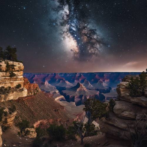 The Grand Canyon under the starry sky filled with a myriad of twinkling stars.