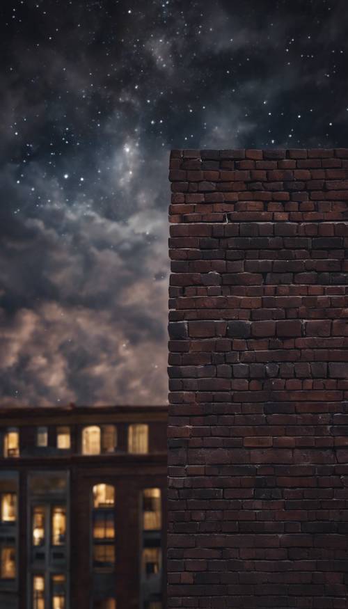 구름 가득한 별이 가득한 밤하늘 아래 어두운 벽돌 벽.