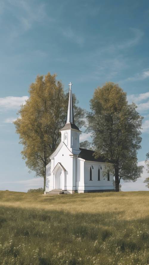 Una piccola chiesa bianca in un pittoresco paesaggio di campagna con un cielo azzurro e limpido in alto.