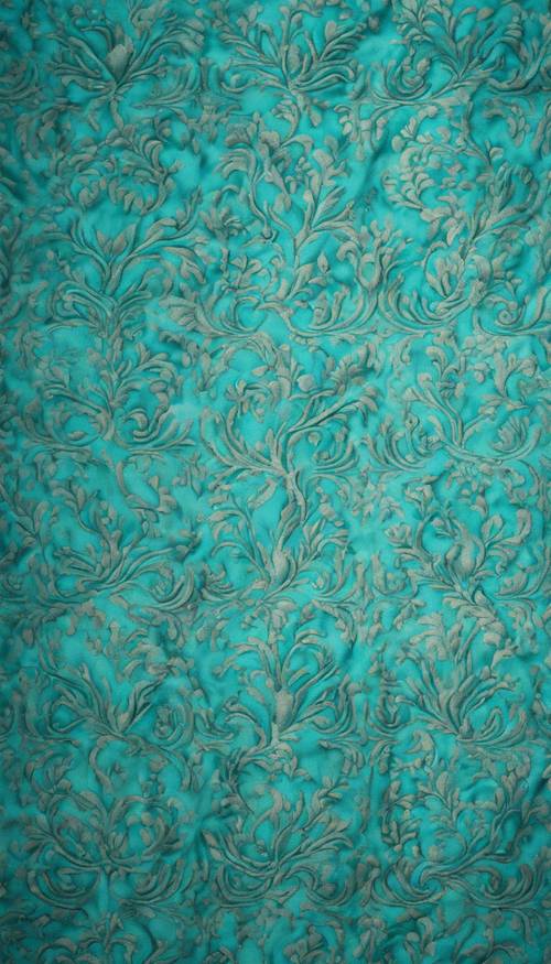 Яркий бирюзовый дамасский узор на шелковой ткани.