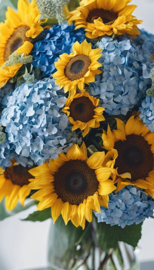 A beautifully arranged bouquet with a mix of yellow sunflowers and blue hydrangeas.