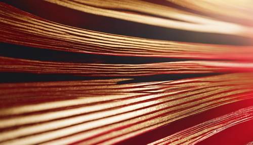 Bright red and shiny gold stripes in varying thicknesses creating a rhythmic, fashionable pattern.