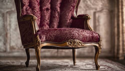 Burgundy textured brocade on an antique chair in a vintage setting.