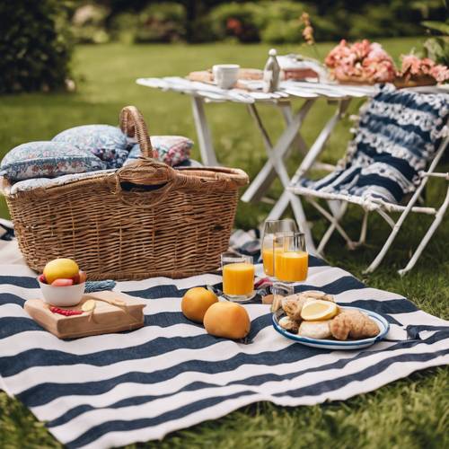 An outdoor picnic scene set in a lush garden, featuring preppy boho style picnic accessories, wicker basket, striped blanket, and floral cushions.
