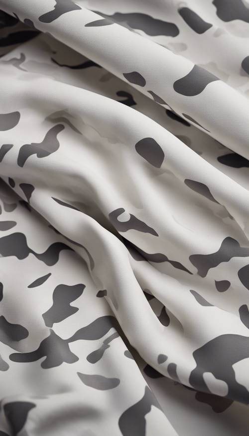 A close-up image of white camouflage fabric in high detail. Tapet [c7696e957cbb4c45b13f]
