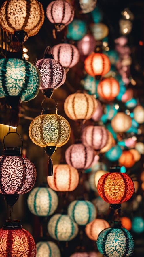 Handmade paper lanterns with intricate Islamic designs glowing warmly in the night market during Ramadan.