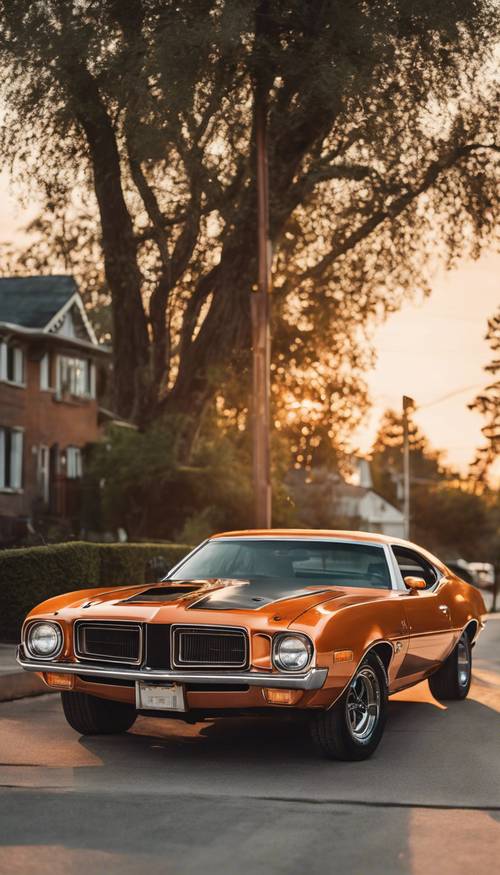 A mint-condition, gleaming orange 70s muscle car, parked on a quiet suburban street at sunset.