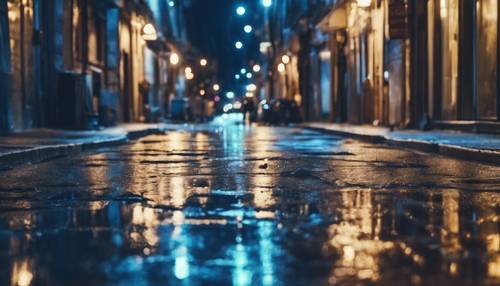 An empty city street at night, soaked in blue grunge elegance.