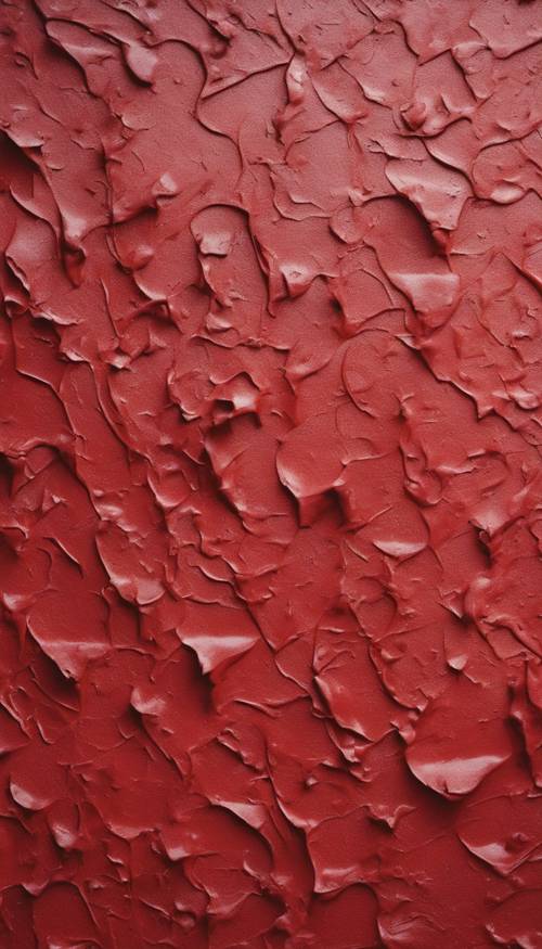 A close-up view of a textured wall freshly painted in scarlet.