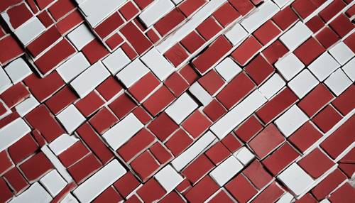 An intricate array of red and white bricks positioned in a herringbone pattern.