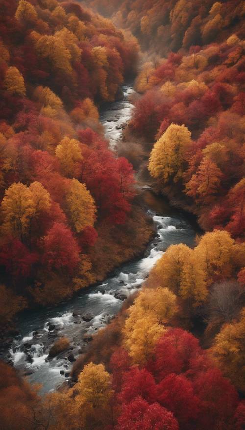 Una pittoresca valle autunnale con alberi rossi e dorati e un ruscello cristallino che serpeggia al suo interno.