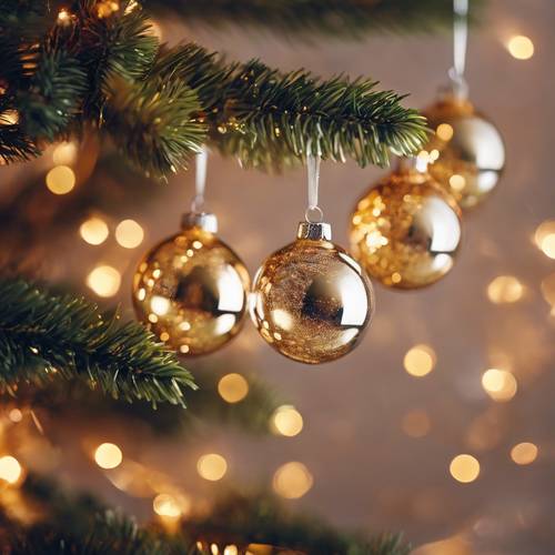 Shimmering glass Christmas tree ornaments delicately hanging on the branches, their surfaces reflecting the warm glow of string lights.