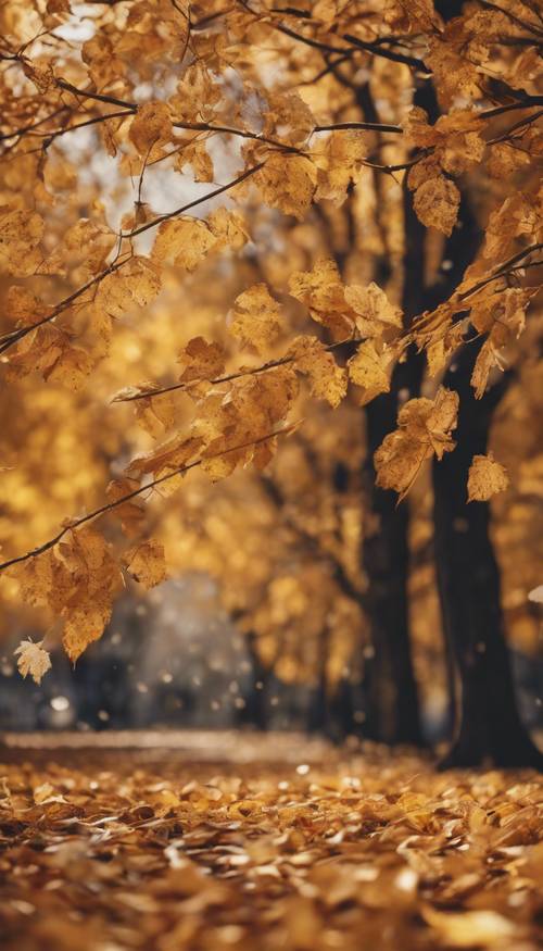 갈색과 노란색 나뭇잎이 나무에서 떨어지는 활기찬 가을 풍경입니다.