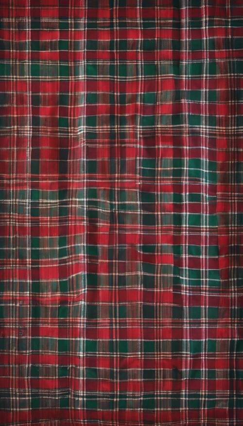A dark plaid patterned tablecloth set for a Christmas eve dinner. Tapeta [70dafdc35d0748f4aa8b]