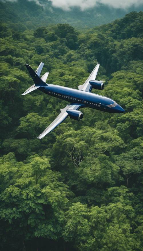 A navy blue airplane flying over a dense green rainforest during the day.