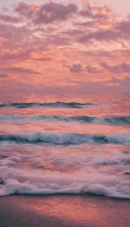 A seascape at dusk, where the sky is filled with fluffy cotton candy clouds dotted with hues of pink and orange.